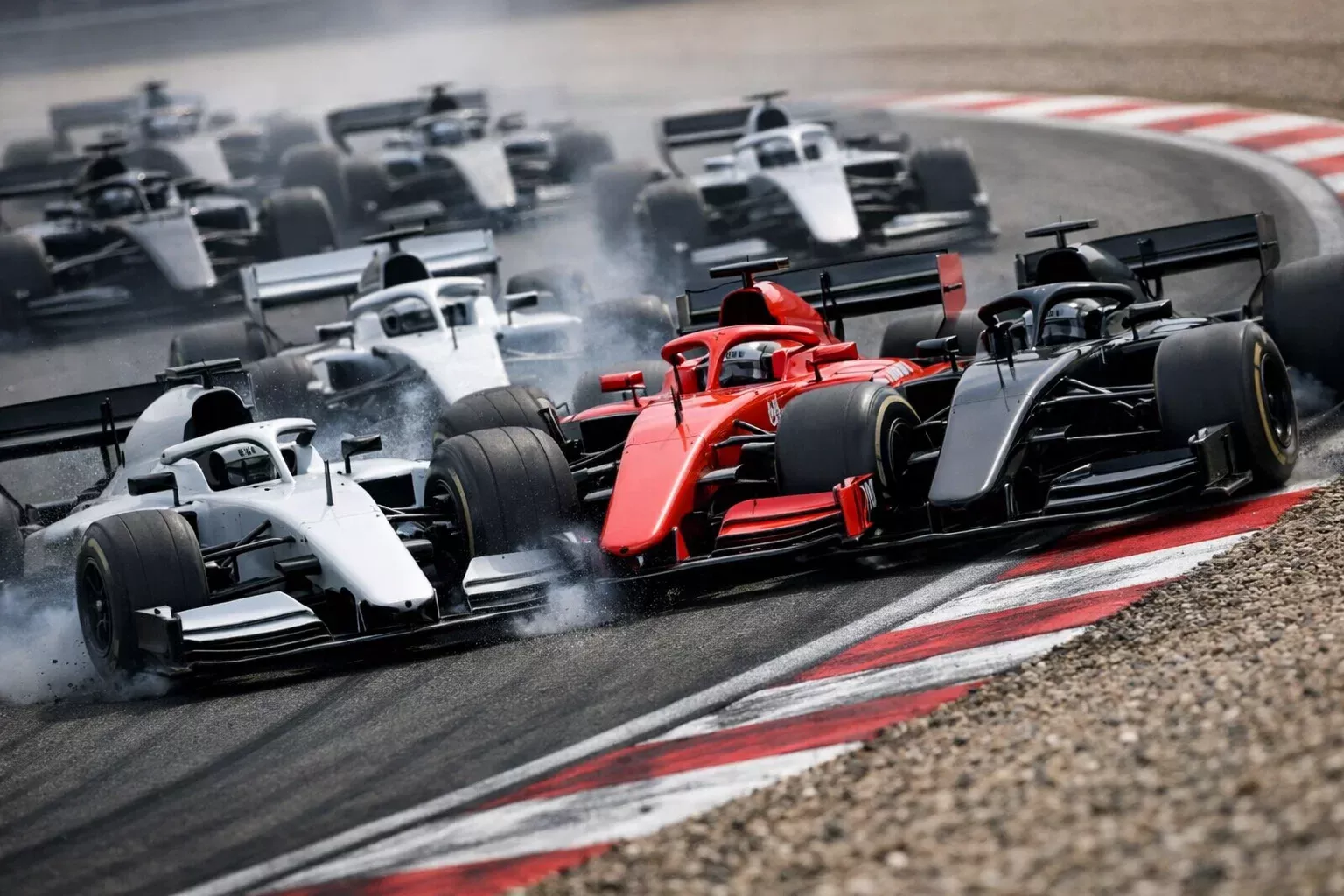 Formel-1-Autos kämpfen Rad an Rad in der ersten Kurve nach dem Start